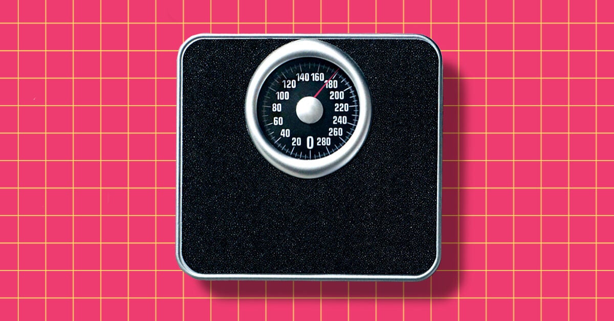 A person checking their weight on a scale