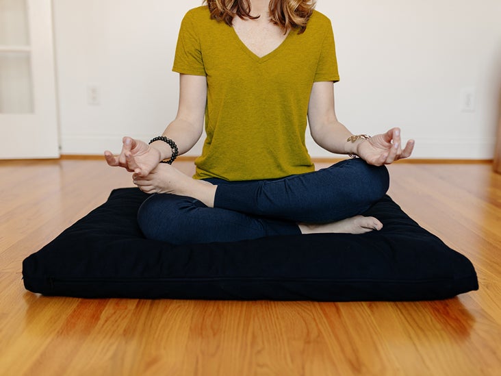 sitting on meditation cushion