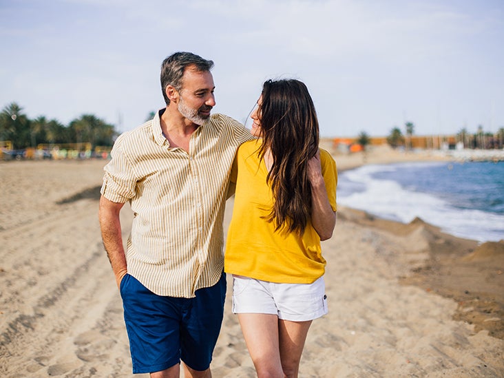 couple walking together on beach 732x549 thumbnail